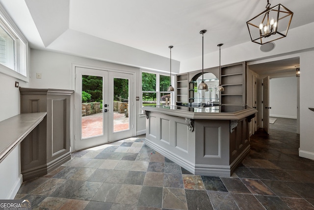 115 Hopewell Grove Dr, Milton, GA 30004 - kitchen with open shelves, stone tile flooring, french doors, baseboards, and decorative light fixtures