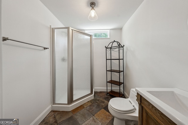 115 Hopewell Grove Dr, Milton, GA 30004 - full bathroom with a stall shower, toilet, baseboards, stone finish floors, and vanity