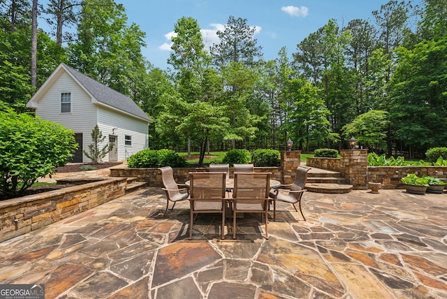 115 Hopewell Grove Dr, Milton, GA 30004 - view of patio featuring outdoor dining space, an outdoor structure, and view of wooded area