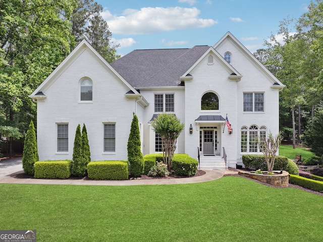 115 Hopewell Grove Dr, Milton, GA 30004 - view of front of property featuring a front yard, brick siding, and a shingled roof