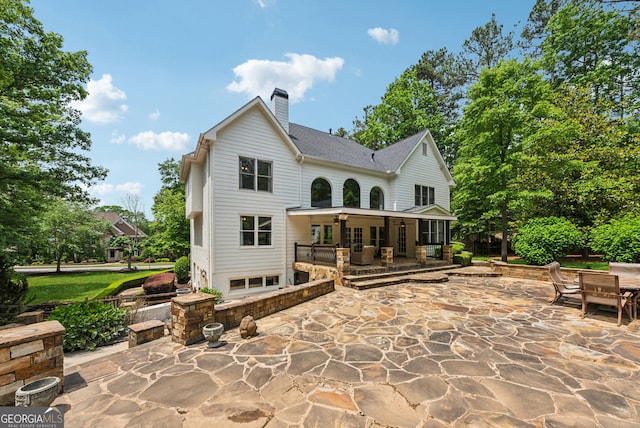 115 Hopewell Grove Dr, Milton, GA 30004 - back of house featuring a patio, a chimney, a ceiling fan, and roof with shingles