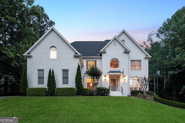 115 Hopewell Grove Dr, Milton, GA 30004 - french country inspired facade featuring brick siding, a front yard, and a shingled roof