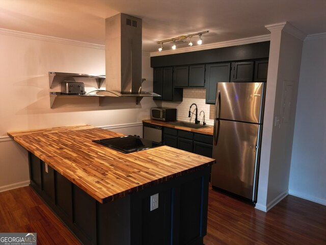 605 Candler St Unit A8, Gainesville, GA 30501 - kitchen with butcher block countertops, appliances with stainless steel finishes, island exhaust hood, a sink, and tasteful backsplash
