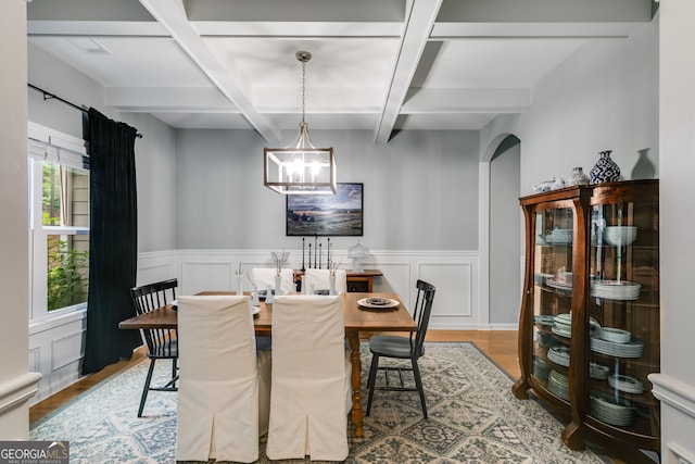 13 Westbrook Rd, Carrollton, GA 30116 - dining area featuring coffered ceiling, wood finished floors, arched walkways, beamed ceiling, and a wainscoted wall