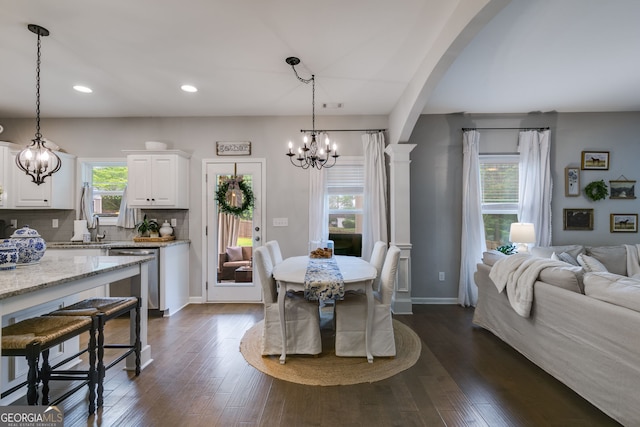 13 Westbrook Rd, Carrollton, GA 30116 - dining room featuring a chandelier, arched walkways, recessed lighting, and dark wood-type flooring