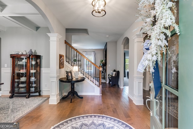 13 Westbrook Rd, Carrollton, GA 30116 - entrance foyer featuring arched walkways, wood-type flooring, ornate columns, and stairway