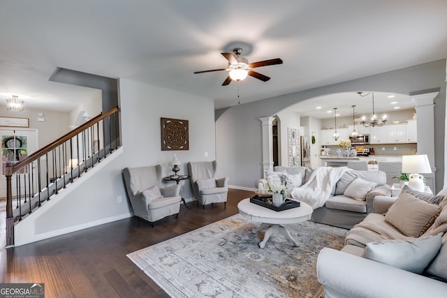 13 Westbrook Rd, Carrollton, GA 30116 - living room with decorative columns, arched walkways, a chandelier, stairway, and a ceiling fan