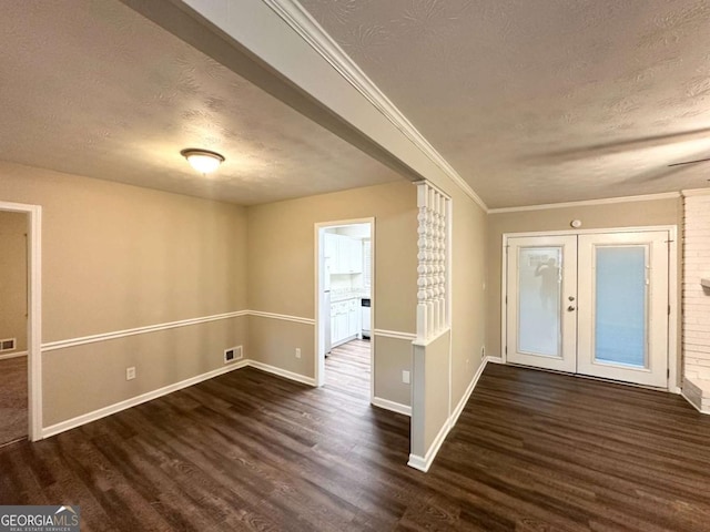 1918 Leigh Dr SW, Conyers, GA 30094 - foyer entrance with a textured ceiling, dark wood-style floors, french doors, baseboards, and ornamental molding