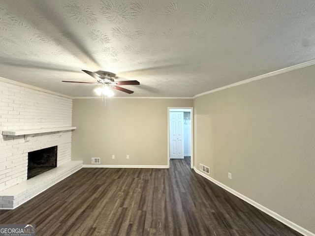 1918 Leigh Dr SW, Conyers, GA 30094 - unfurnished living room with ceiling fan, wood finished floors, baseboards, a brick fireplace, and ornamental molding