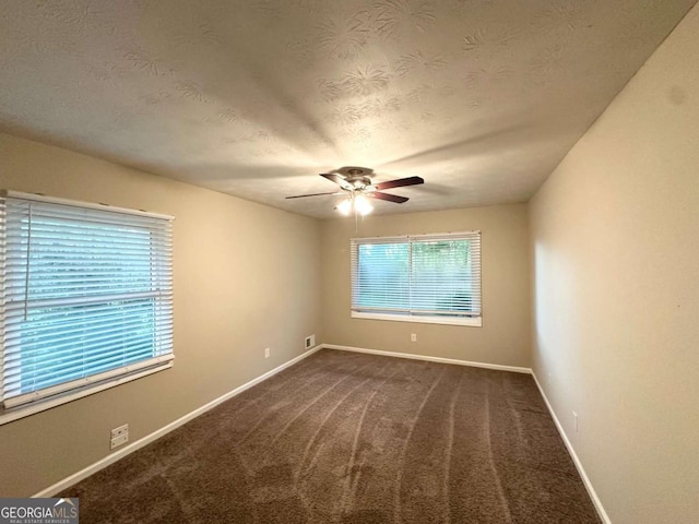 1918 Leigh Dr SW, Conyers, GA 30094 - carpeted empty room featuring a textured ceiling, a ceiling fan, and baseboards