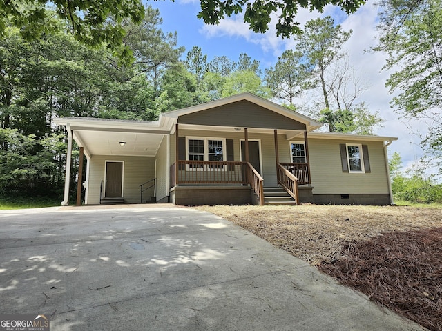 70 Shadow Ln, Carrollton, GA 30117 - view of front of home featuring driveway, crawl space, a carport, and covered porch