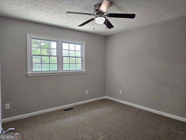 70 Shadow Ln, Carrollton, GA 30117 - carpeted spare room featuring a textured ceiling, ceiling fan, and baseboards