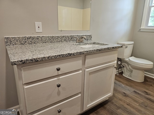 70 Shadow Ln, Carrollton, GA 30117 - bathroom with vanity, wood finished floors, toilet, and baseboards