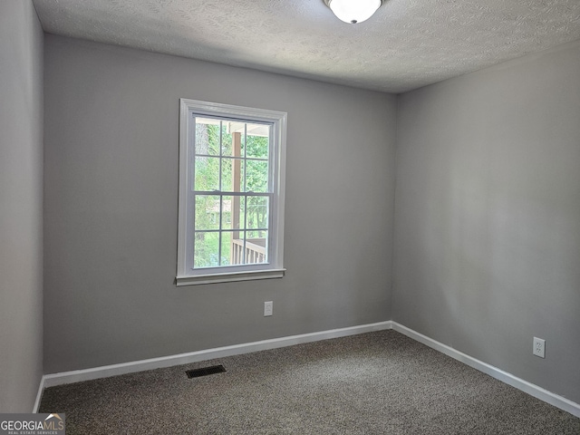 70 Shadow Ln, Carrollton, GA 30117 - carpeted spare room featuring baseboards and a textured ceiling