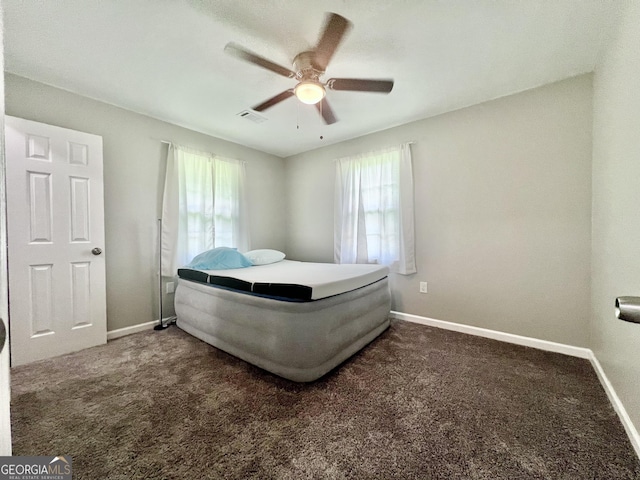 1962 Anderson Rd, Rentz, GA 31075 - carpeted bedroom with baseboards and a ceiling fan