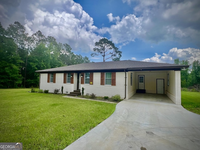1962 Anderson Rd, Rentz, GA 31075 - single story home with concrete driveway, brick siding, and a front yard