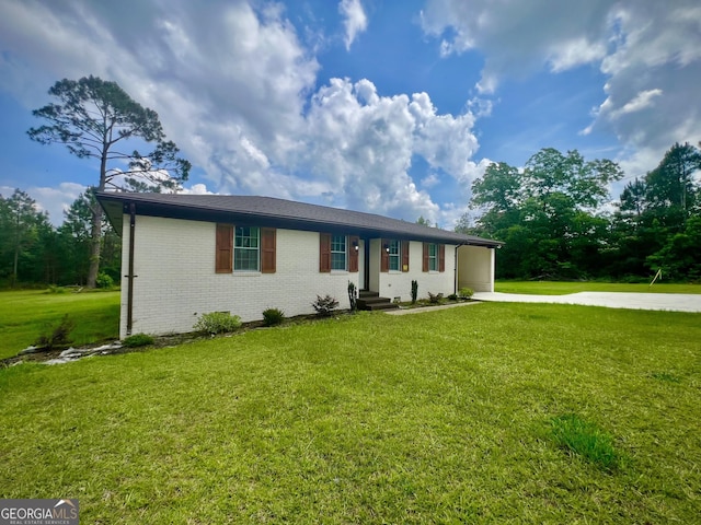 1962 Anderson Rd, Rentz, GA 31075 - ranch-style home with concrete driveway, a front lawn, an attached carport, and brick siding
