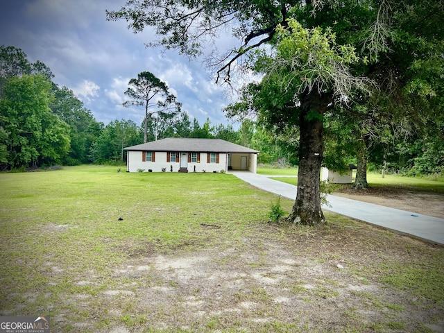 1962 Anderson Rd, Rentz, GA 31075 - ranch-style house with concrete driveway, a front lawn, and an attached carport