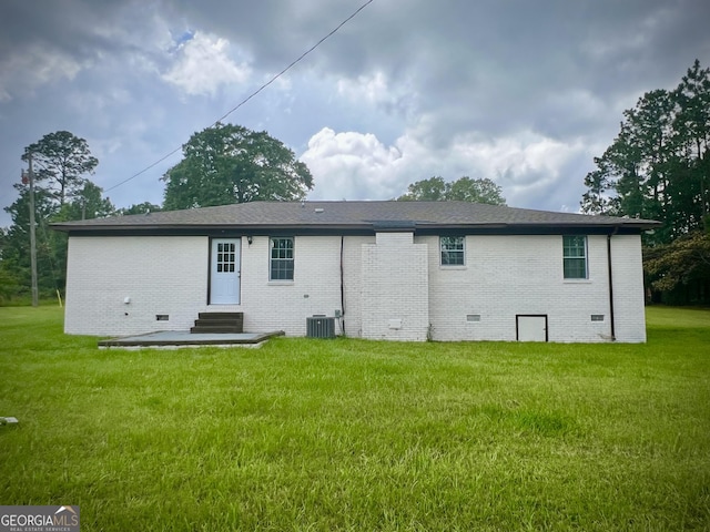 1962 Anderson Rd, Rentz, GA 31075 - back of property with crawl space, entry steps, brick siding, and a lawn