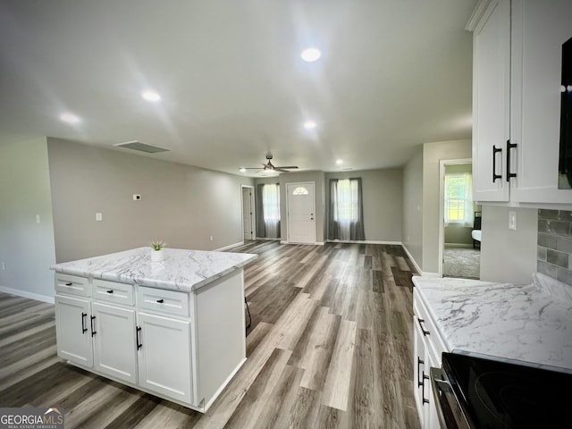 1962 Anderson Rd, Rentz, GA 31075 - kitchen with baseboards, wood finished floors, electric stove, and recessed lighting