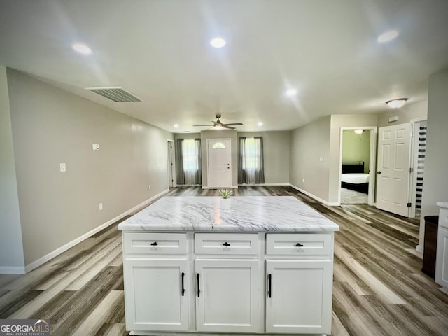 1962 Anderson Rd, Rentz, GA 31075 - kitchen with baseboards, light wood-style floors, white cabinets, and recessed lighting
