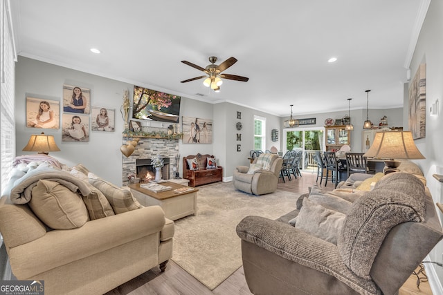 49 Grove Ct, Royston, GA 30662 - living room featuring ceiling fan, ornamental molding, recessed lighting, a fireplace, and light wood-style floors