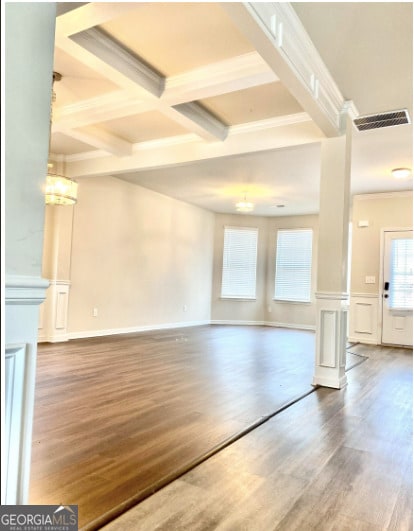 413 Atlas Ct, Locust Grove, GA 30248 - unfurnished living room with wood finished floors, beam ceiling, crown molding, and coffered ceiling