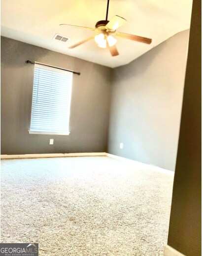 413 Atlas Ct, Locust Grove, GA 30248 - carpeted empty room featuring a ceiling fan and baseboards