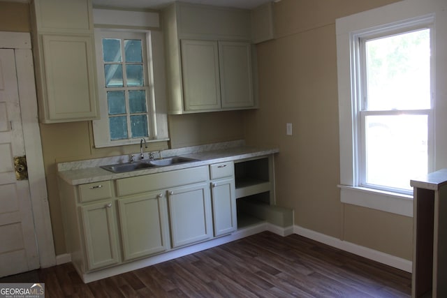 311 W 11th St, Tifton, GA 31794 - kitchen with a sink, dark wood-style flooring, light countertops, and baseboards