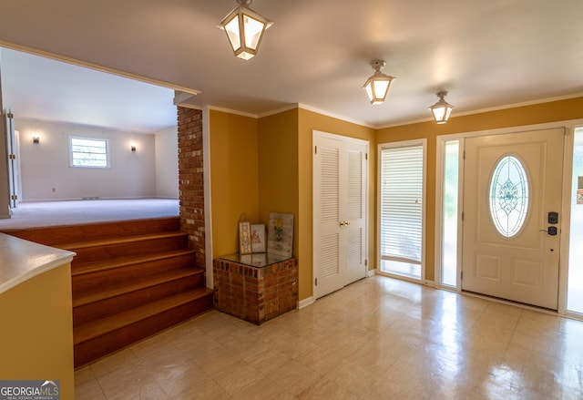 6214 Crestview Dr SE, Covington, GA 30014 - entrance foyer featuring crown molding and tile patterned floors