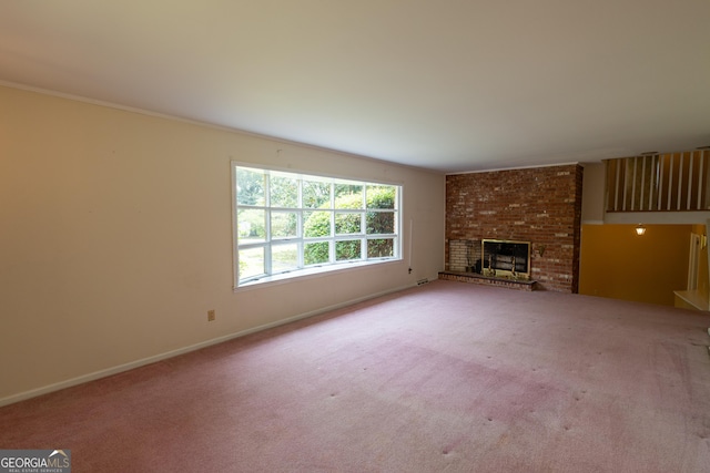 6214 Crestview Dr SE, Covington, GA 30014 - unfurnished living room with carpet, baseboards, and a brick fireplace