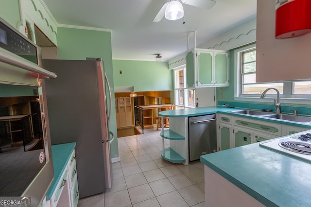 6214 Crestview Dr SE, Covington, GA 30014 - kitchen featuring stainless steel appliances, a sink, a peninsula, light tile patterned floors, and open shelves