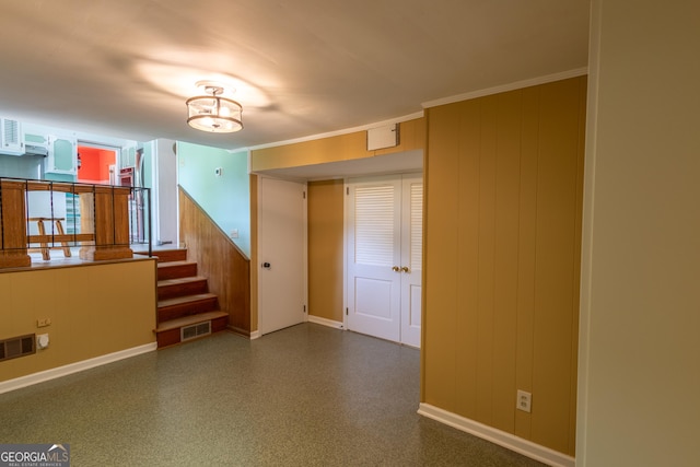 6214 Crestview Dr SE, Covington, GA 30014 - empty room featuring baseboards, stairway, and wooden walls