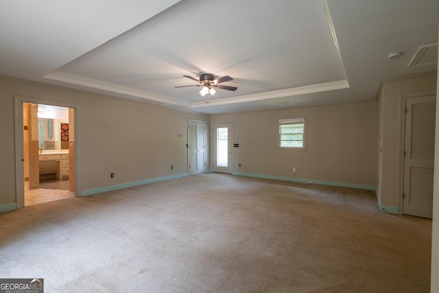 6214 Crestview Dr SE, Covington, GA 30014 - unfurnished room with a raised ceiling, ornamental molding, light colored carpet, and ceiling fan