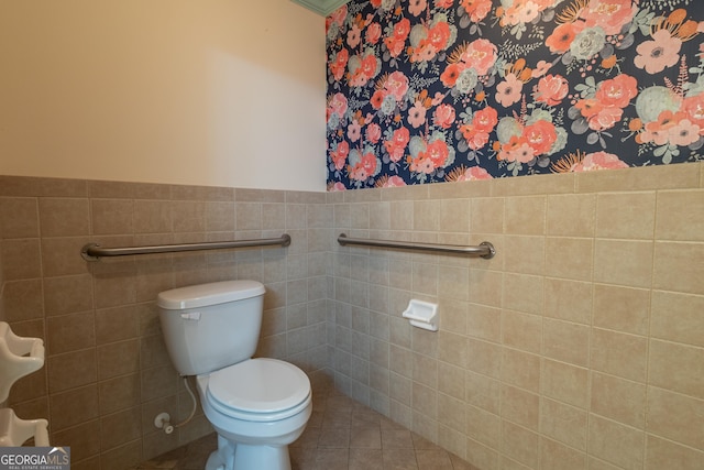 6214 Crestview Dr SE, Covington, GA 30014 - bathroom with toilet, tile walls, and tile patterned floors