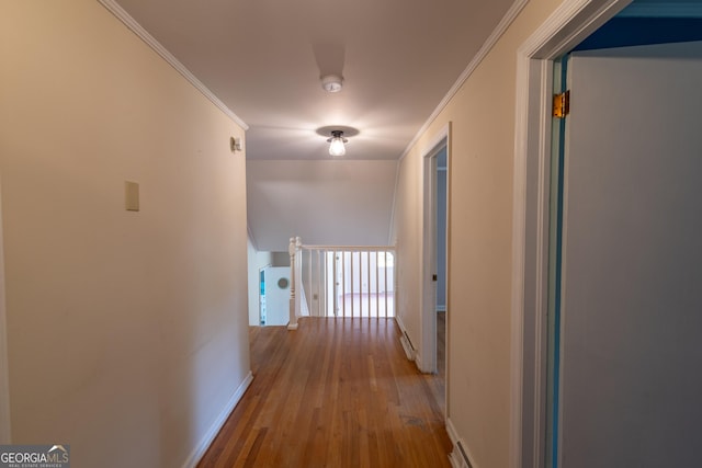 6214 Crestview Dr SE, Covington, GA 30014 - hallway featuring baseboards, an upstairs landing, wood finished floors, and crown molding