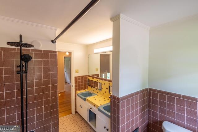 6214 Crestview Dr SE, Covington, GA 30014 - bathroom with ornamental molding, toilet, tile walls, vanity, and wainscoting