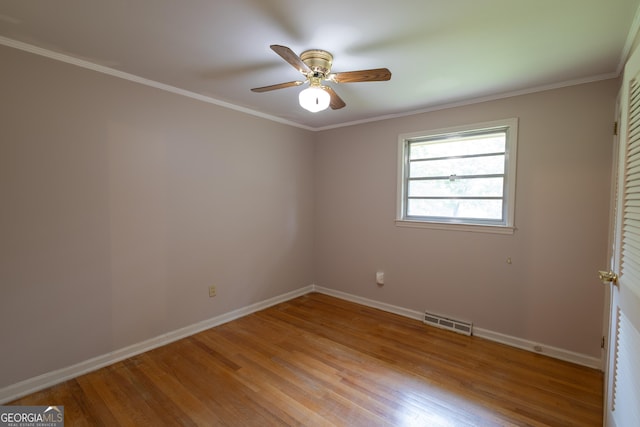 6214 Crestview Dr SE, Covington, GA 30014 - unfurnished bedroom featuring light wood-type flooring, baseboards, ornamental molding, and ceiling fan