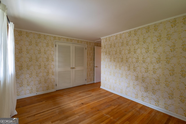 6214 Crestview Dr SE, Covington, GA 30014 - empty room featuring wood finished floors, baseboards, and ornamental molding
