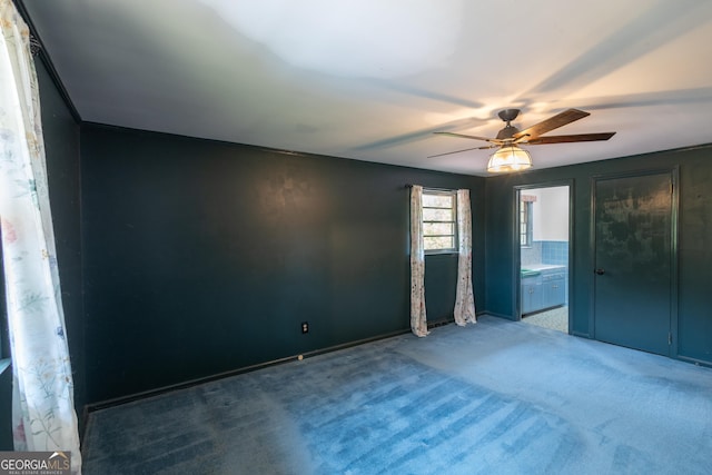 6214 Crestview Dr SE, Covington, GA 30014 - spare room with a ceiling fan and carpet floors