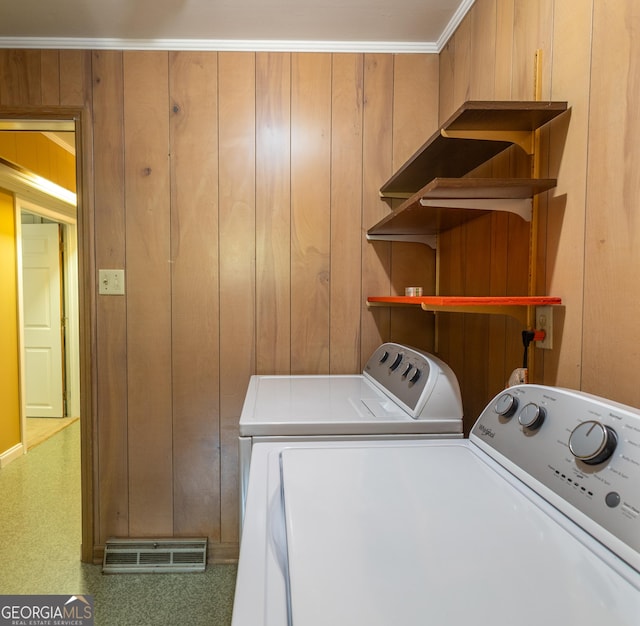 6214 Crestview Dr SE, Covington, GA 30014 - laundry room with washing machine and clothes dryer and wooden walls
