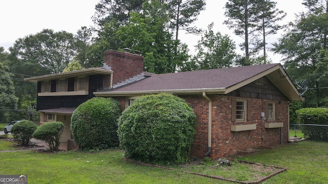 6214 Crestview Dr SE, Covington, GA 30014 - view of front of home with a chimney, brick siding, and roof with shingles