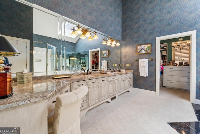 2917 Pointe Dr, Gainesville, GA 30506 - full bath with wallpapered walls, vanity, a shower stall, a spacious closet, and a chandelier