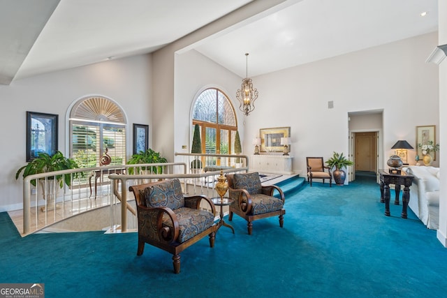2917 Pointe Dr, Gainesville, GA 30506 - carpeted living area featuring high vaulted ceiling, plenty of natural light, and a chandelier