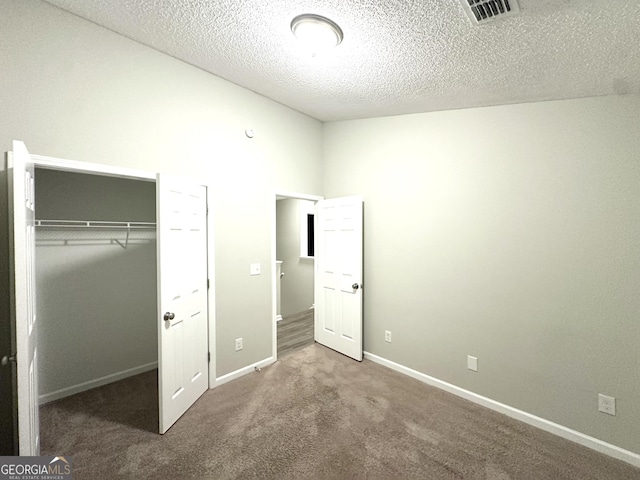 408 Kendall Ln, Mcdonough, GA 30253 - unfurnished bedroom with carpet, a closet, a textured ceiling, and baseboards