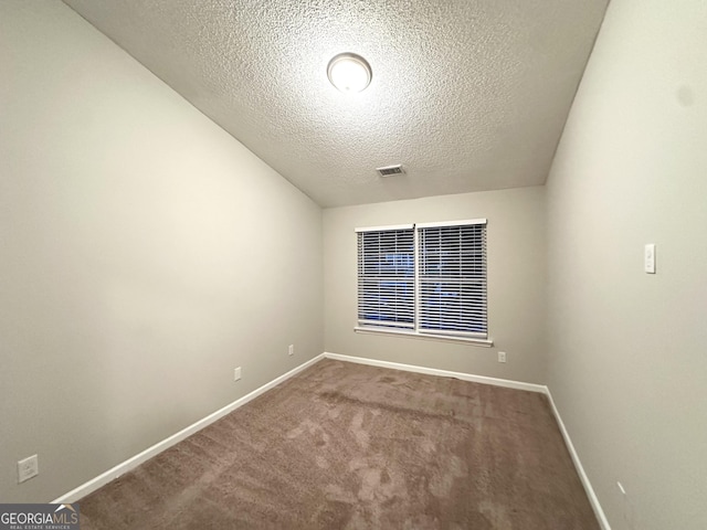 408 Kendall Ln, Mcdonough, GA 30253 - spare room featuring carpet flooring, baseboards, and a textured ceiling
