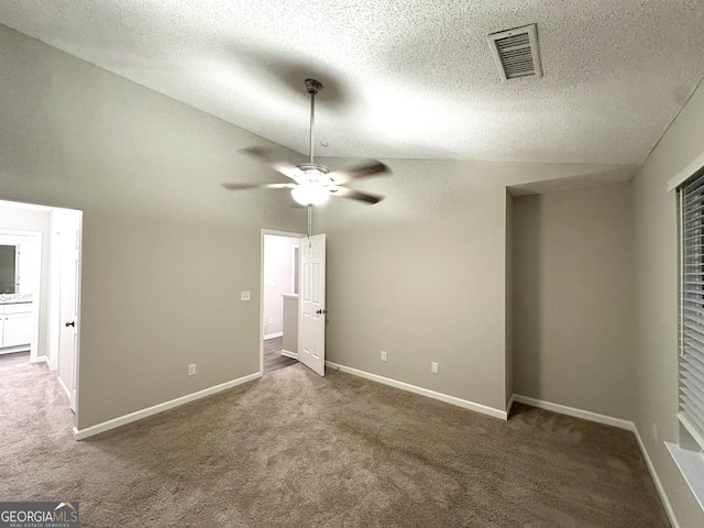 408 Kendall Ln, Mcdonough, GA 30253 - unfurnished bedroom featuring carpet flooring, vaulted ceiling, a textured ceiling, baseboards, and a ceiling fan