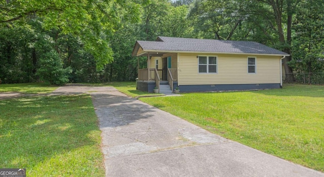 525 Baker Cir NW, Atlanta, GA 30318 - view of front facade with crawl space, driveway, and roof with shingles