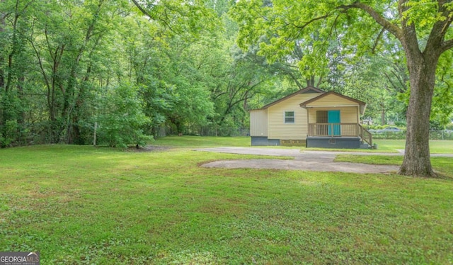 525 Baker Cir NW, Atlanta, GA 30318 - view of green lawn featuring a porch