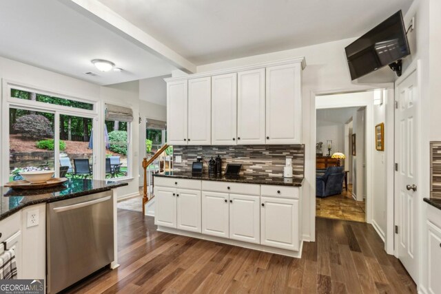 107 W Point Trl, Woodstock, GA 30189 - kitchen with stainless steel dishwasher, tasteful backsplash, white cabinetry, dark wood finished floors, and dark stone countertops
